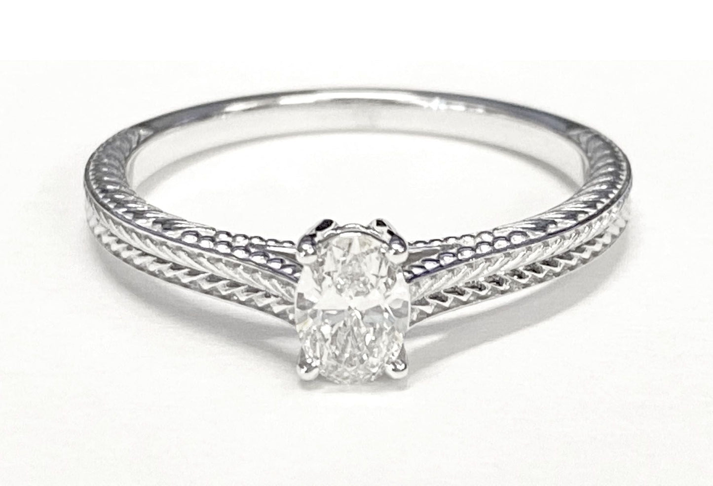 Hand-Engraved Vintage Cathedral Solitaire Oval, in 18K White Gold, prong setting – lifestyle shot | RockHer