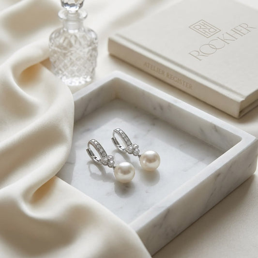 White Pearl And Diamond Dangle Earrings With Clover Top & Miillgrain Detail (8.0-8.5mm) (si), on marble vanity tray with silk