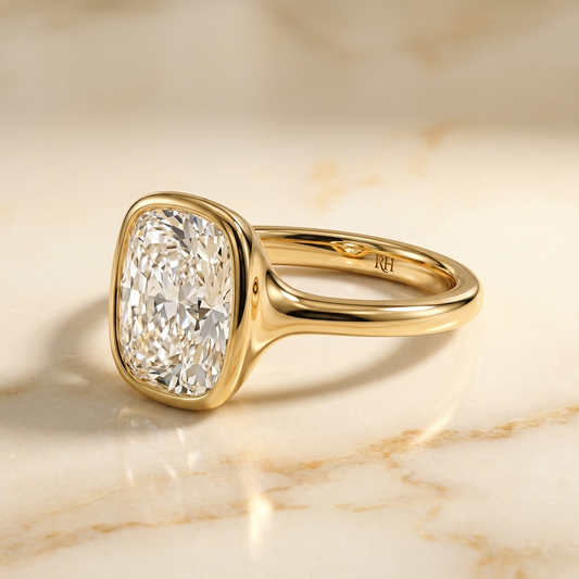 The Agnes Select bezel solitaire cushion engagement ring in 18k yellow gold — alt-angle hero — RockHer