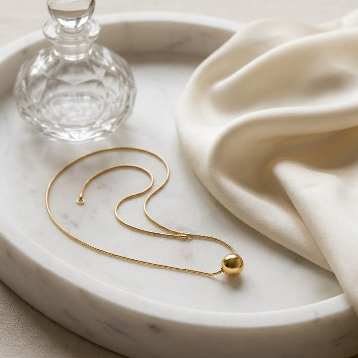 14K Yellow Gold Beaded Station Chain Necklace, 18 Inch, on marble vanity tray with silk