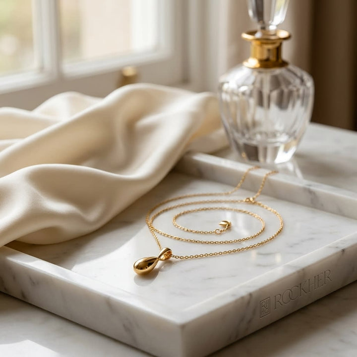 14K Yellow Gold Pear Link Y Necklace, 18 Inch, on marble vanity tray with silk