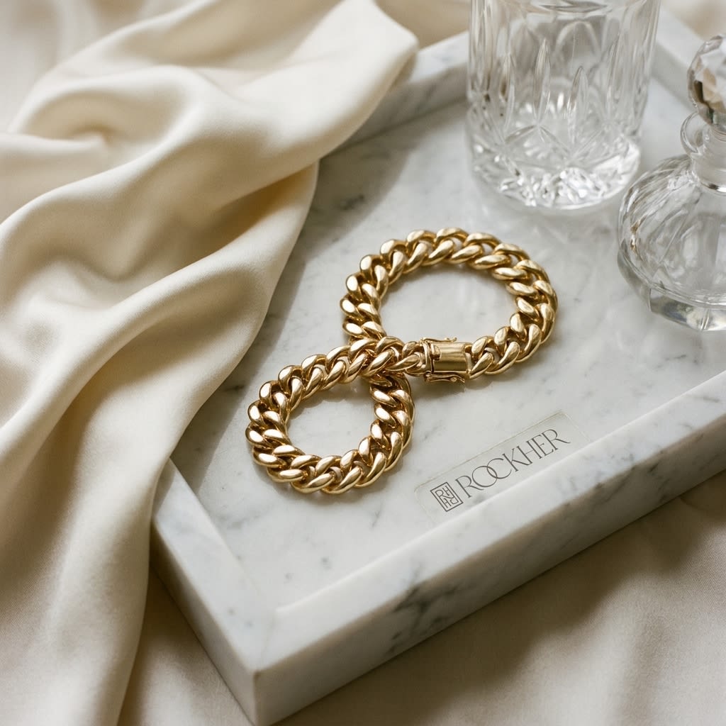 14K Yellow Gold Curb Link Bracelet, 8.5 Inch, on marble vanity tray with silk