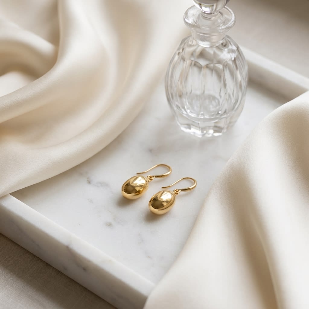 14K Yellow Gold Polished Drop Earrings, on marble vanity tray with silk