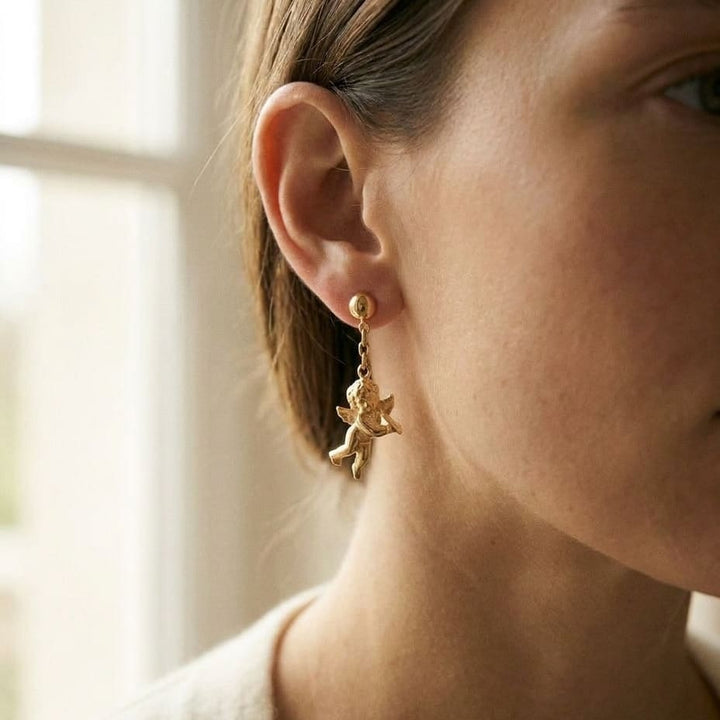 14K Yellow Gold Angel Drop Earrings, worn close-up portrait
