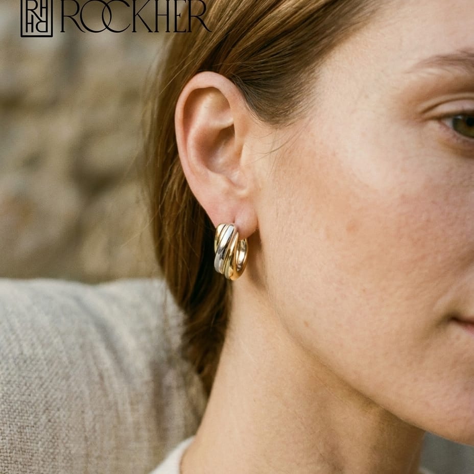 14K Two-Tone Gold Sculpted Hoop Earrings, worn close-up portrait