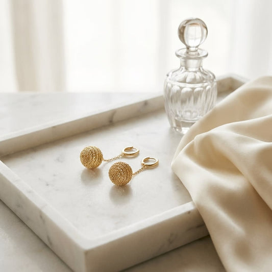 14K Two-Tone Gold Modern Drop Earrings, on marble vanity tray with silk