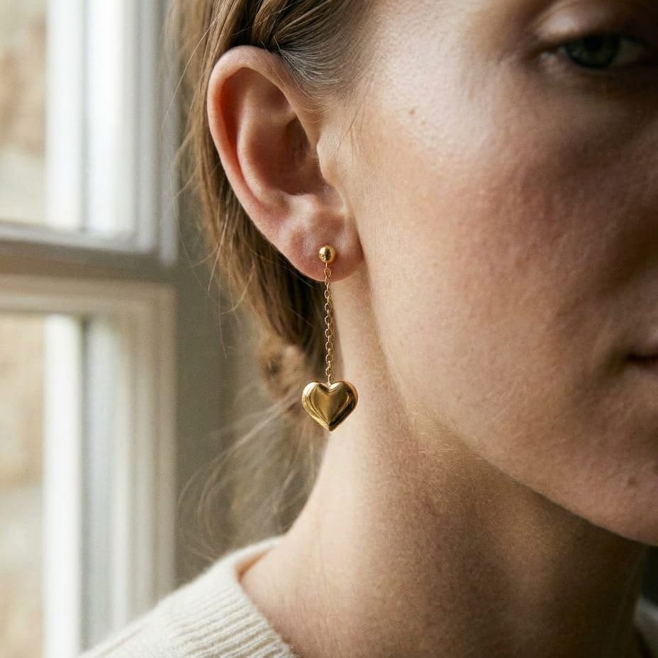14K Yellow Gold Heart Dangle Stud Earrings, worn close-up portrait
