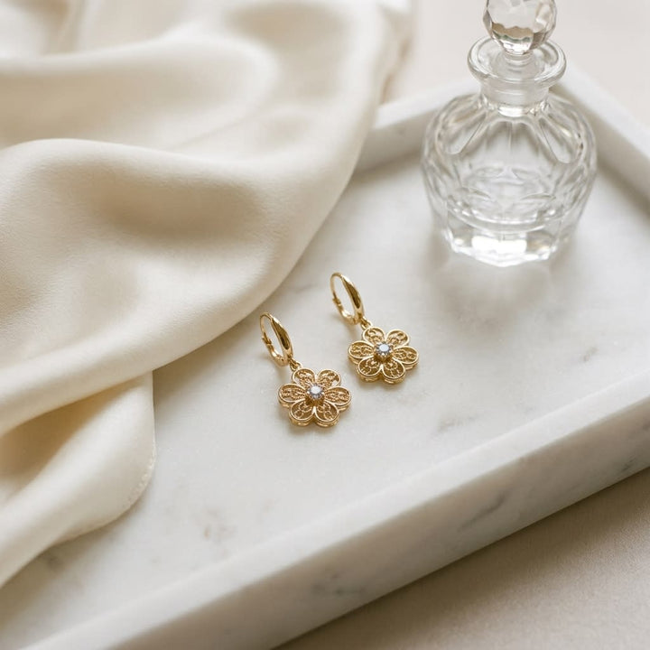 14K Yellow Gold Floral Drop Earrings, on marble vanity tray with silk