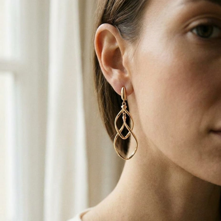 14K Yellow Gold Twisted Open-Link Drop Earrings, worn close-up portrait