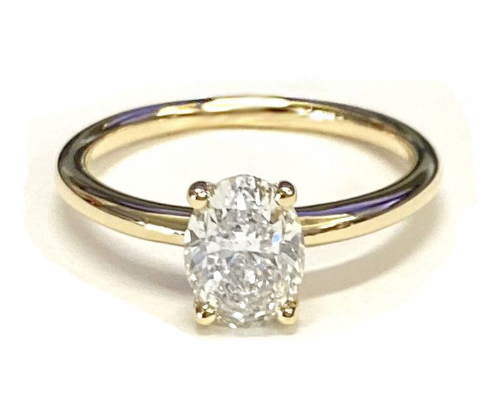 Rounded Comfort Fit Solitaire Oval, in 18K White Gold, prong setting – lifestyle shot | RockHer