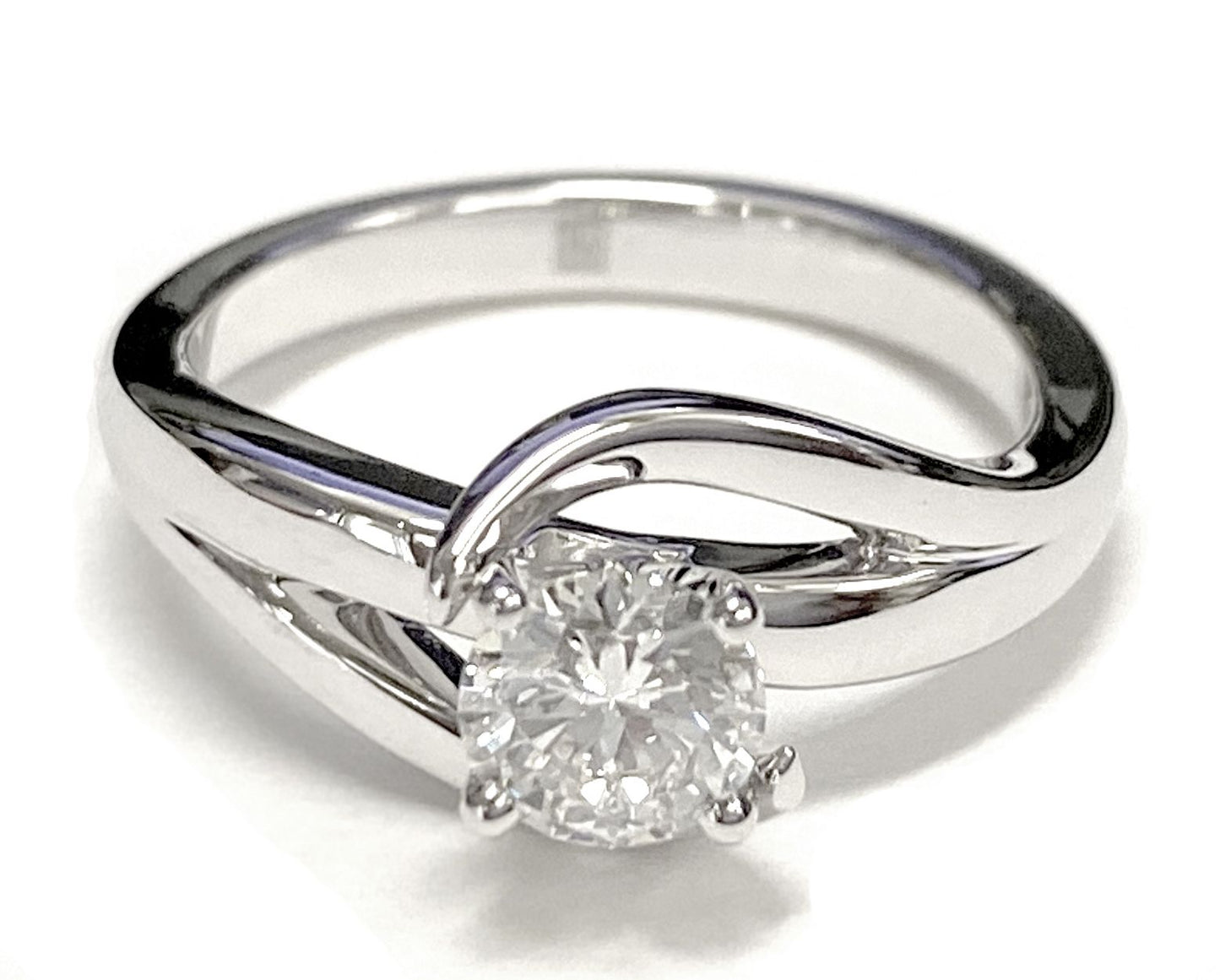 Round Brilliant, Asymmetrical Bypass Twist Solitaire, in 18K White Gold – lifestyle shot | RockHer