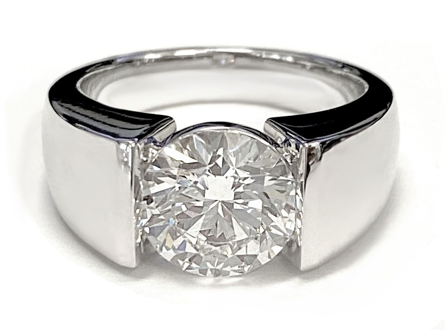 Round Brilliant, Wide High Polish Tension Channel Solitaire, in 18K White Gold – lifestyle shot | RockHer