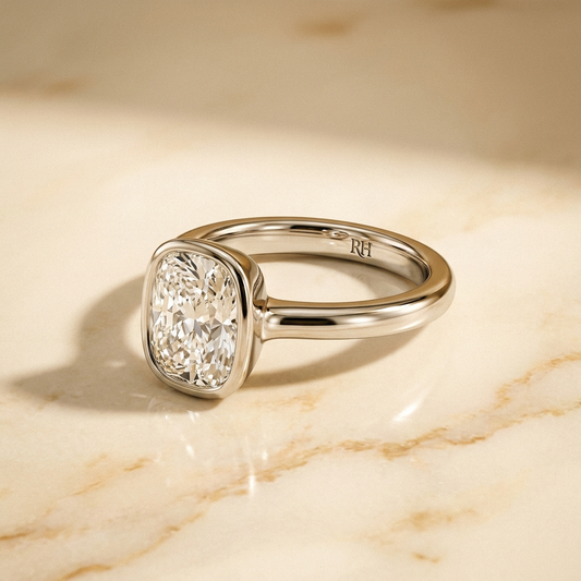 The Agnes Select bezel solitaire cushion engagement ring in platinum — alt-angle hero — RockHer