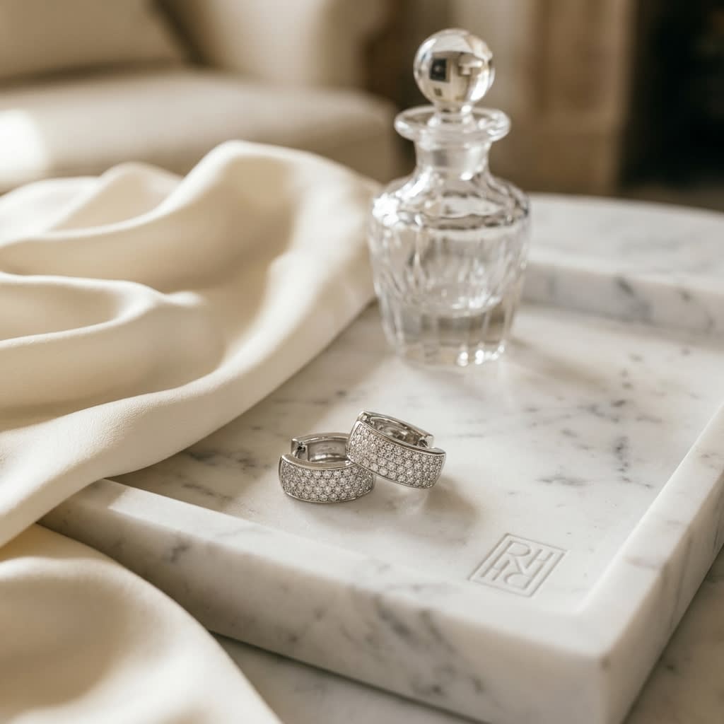 Diamond Earrings in 18K White Gold, on marble vanity tray with silk