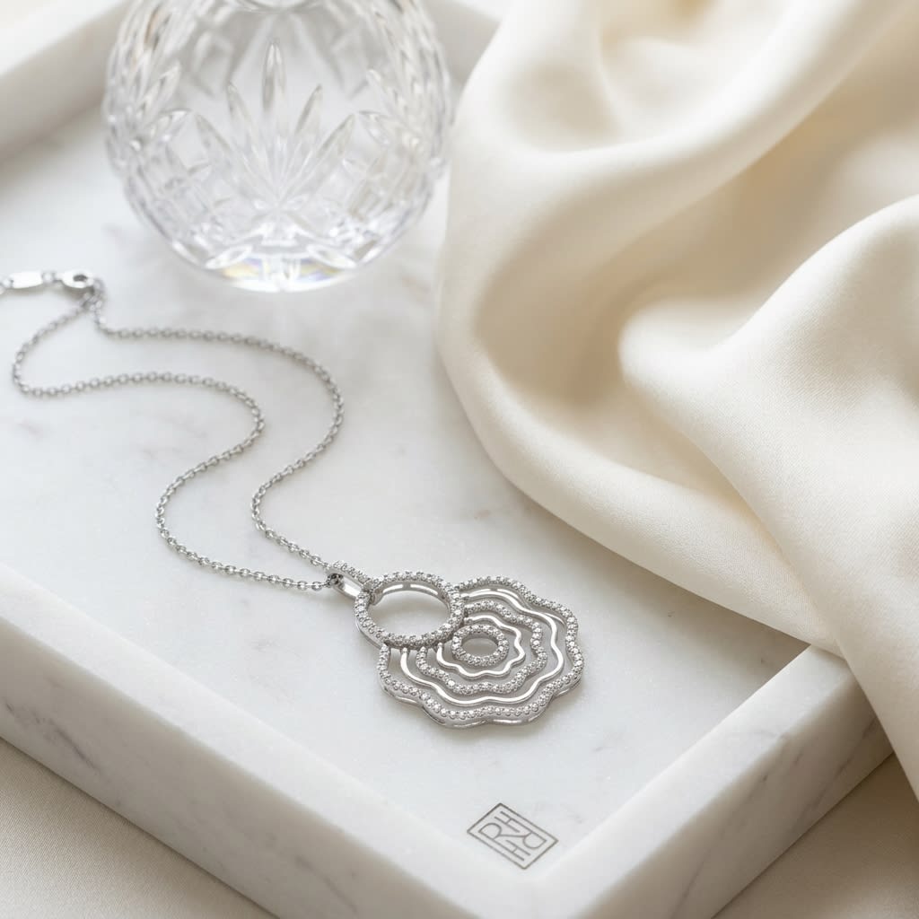 Natural Diamond Round Brilliant Pendant in 18K White Gold, on marble vanity tray with silk