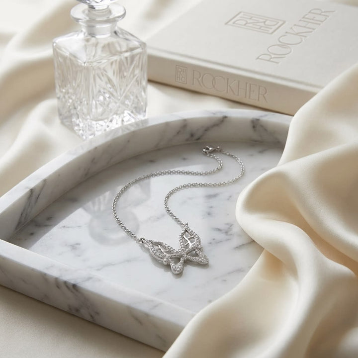 Diamond Floating Butterfly Necklace in 18K White Gold (0.10 Ct.tw), on marble vanity tray with silk