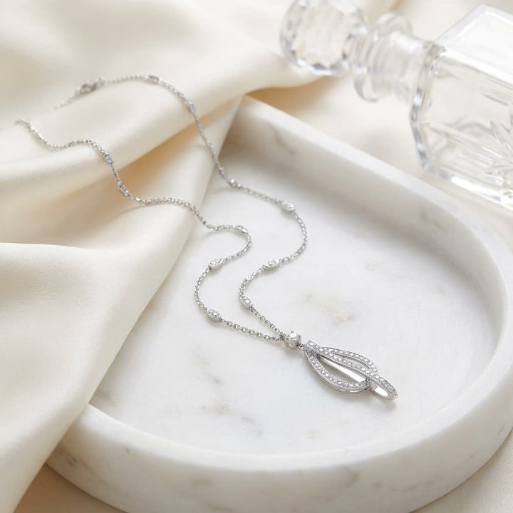 Natural Diamond Round Brilliant Pendant in 18K White Gold, 5 ct. t.w., on marble vanity tray with silk