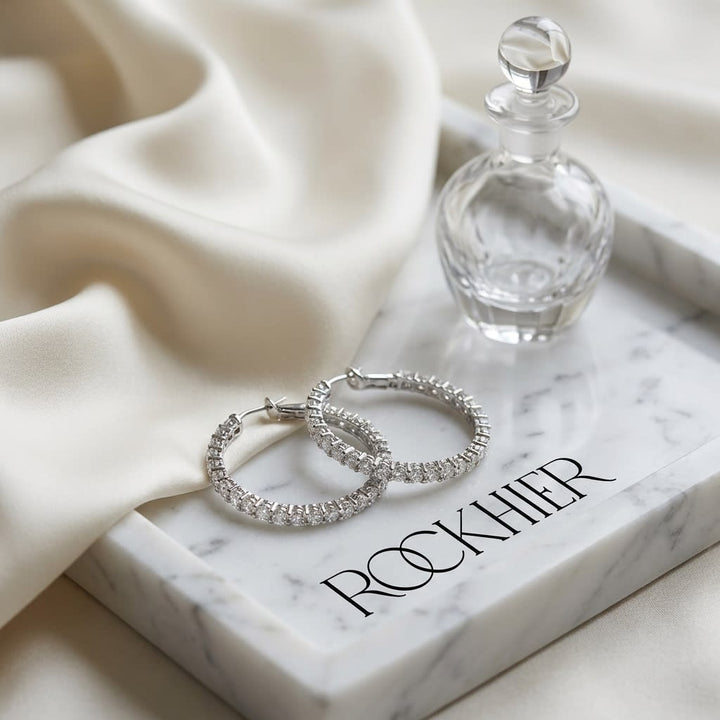 Diamond Hoop Earrings in 18K White Gold, on marble vanity tray with silk