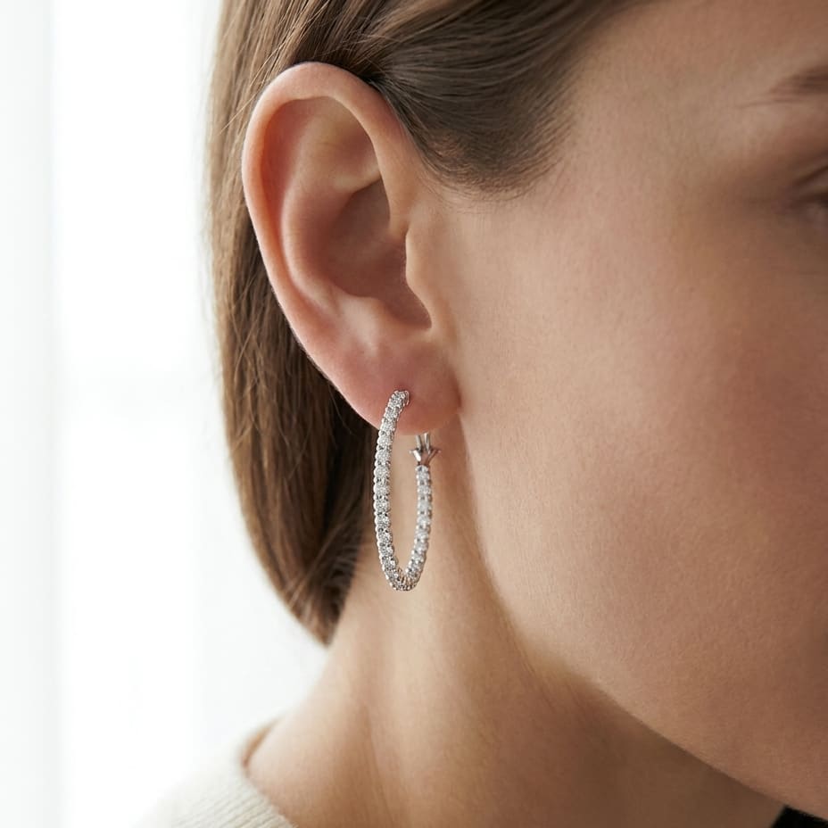 Diamond Hoop Earrings in 18K White Gold, worn close-up portrait