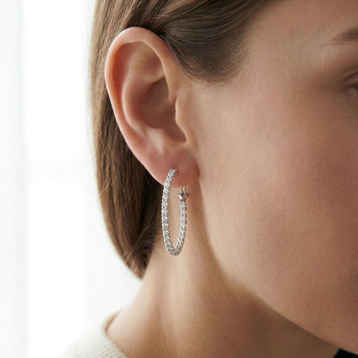 Diamond Hoop Earrings in 18K White Gold, worn close-up portrait