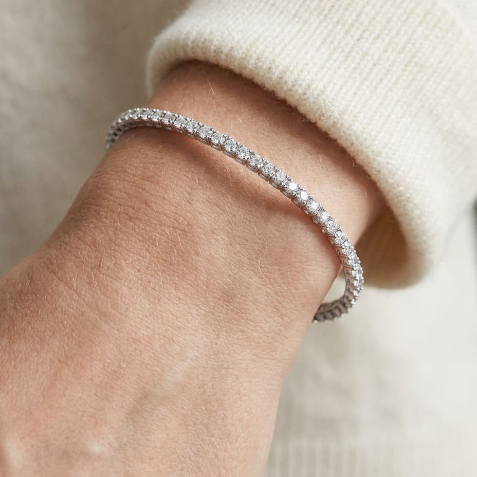 Diamond Open Cuff Bangle With Solid Heart Ends in 18K White Gold, worn close-up portrait