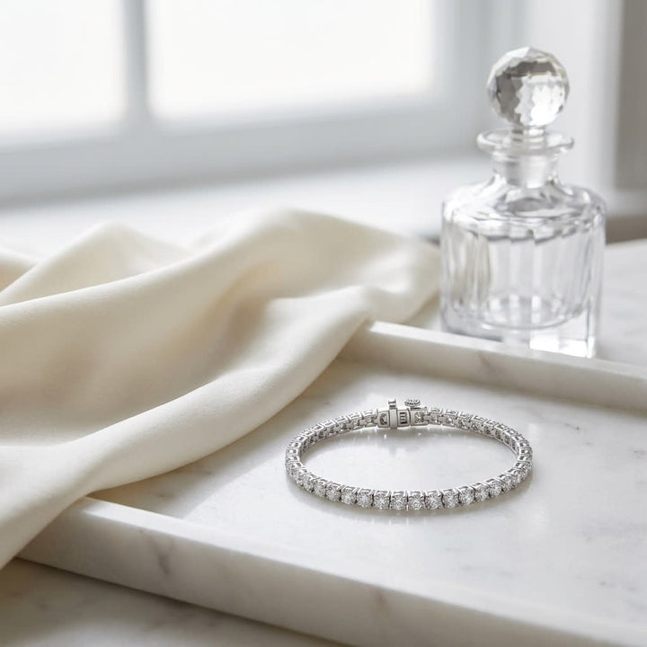 Diamond 4-prong Tennis Bracelet in 18K White Gold, on marble vanity tray with silk