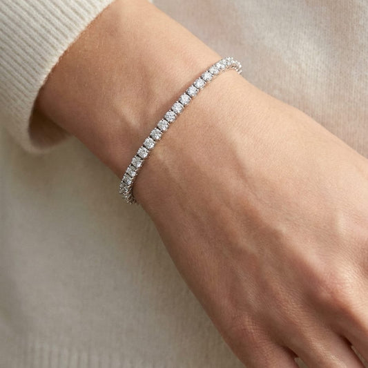 Diamond 4-prong Tennis Bracelet in 18K White Gold, worn close-up portrait