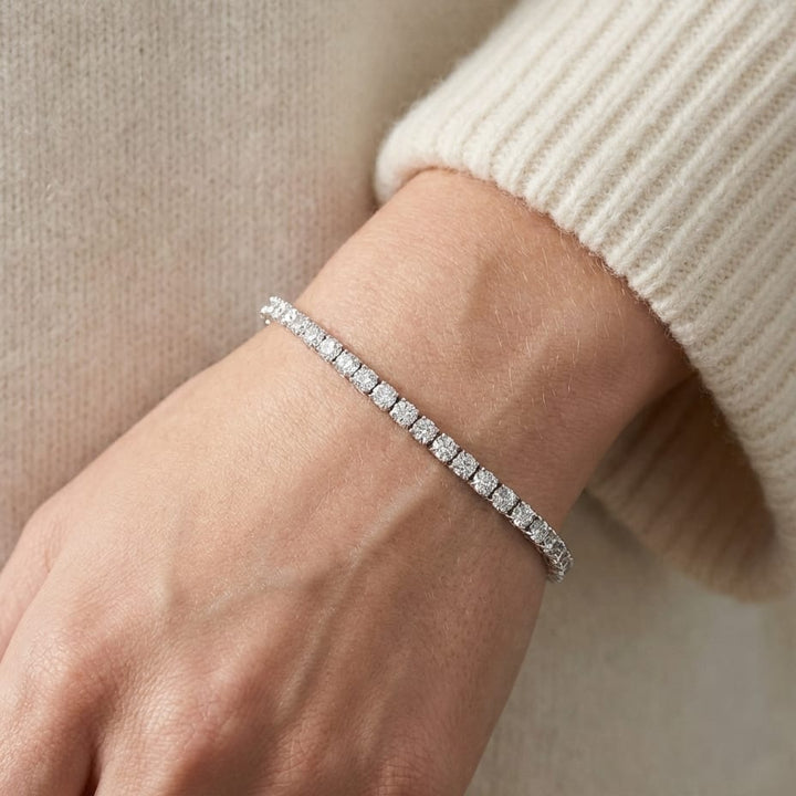 Diamond 4-prong Tennis Bracelet in 18K White Gold, worn close-up portrait