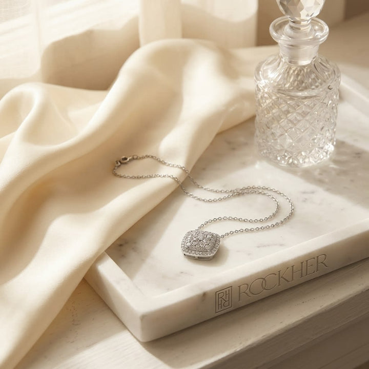 Cushion Diamond Pavé Cluster Necklace in 18K White Gold, 0.50ct, on marble vanity tray with silk