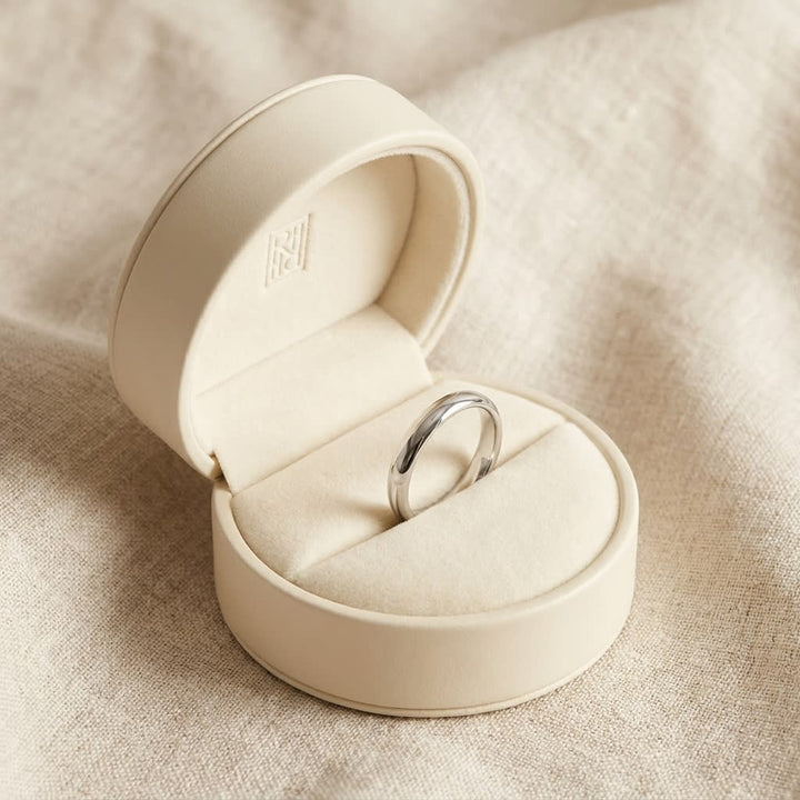 2mm Slightly Domed Traditional Oval Wedding Band in 18K White Gold, in navy velvet jewelry box