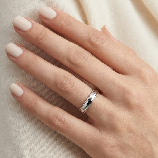 4mm Slightly Domed Traditional Oval Milgrain Wedding Band in 18K White Gold, worn on hand, close-up