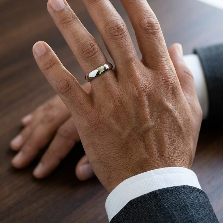 4.5mm Deluxe Comfort-Fit Wedding Band in 18K White Gold, worn on hand, masculine close-up