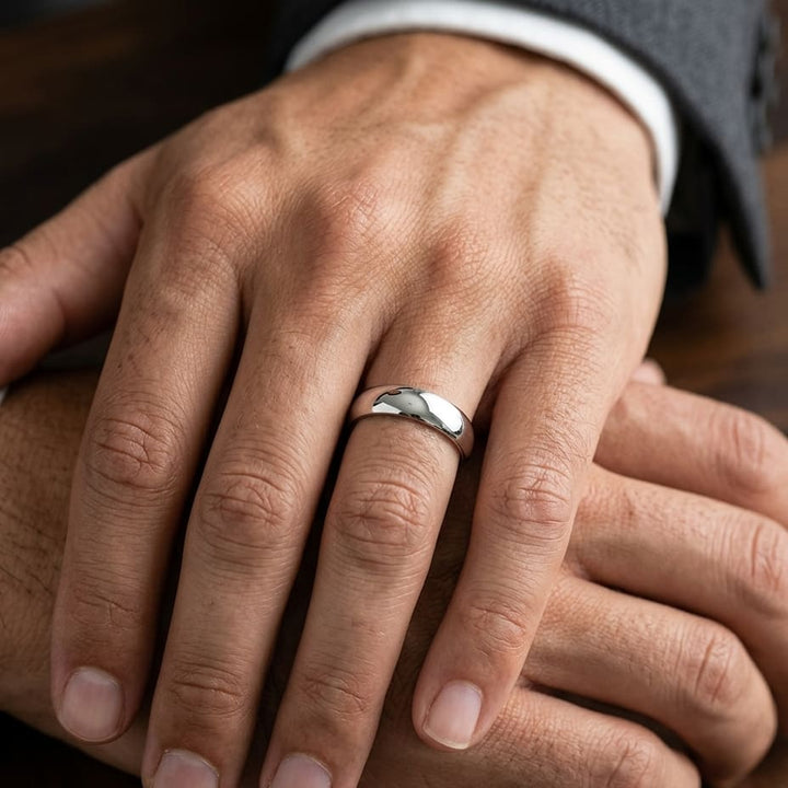 5.5mm Deluxe Comfort-Fit Wedding Band in 18K White Gold, worn on hand, masculine close-up