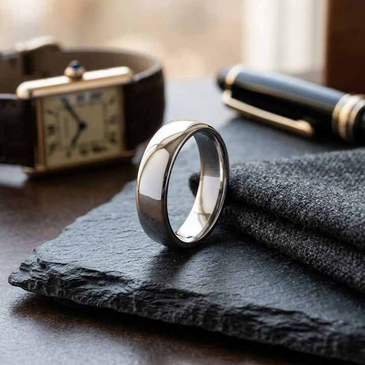 6.5mm Deluxe Comfort-Fit Wedding Band in 18K White Gold, on walnut surface with pocket square