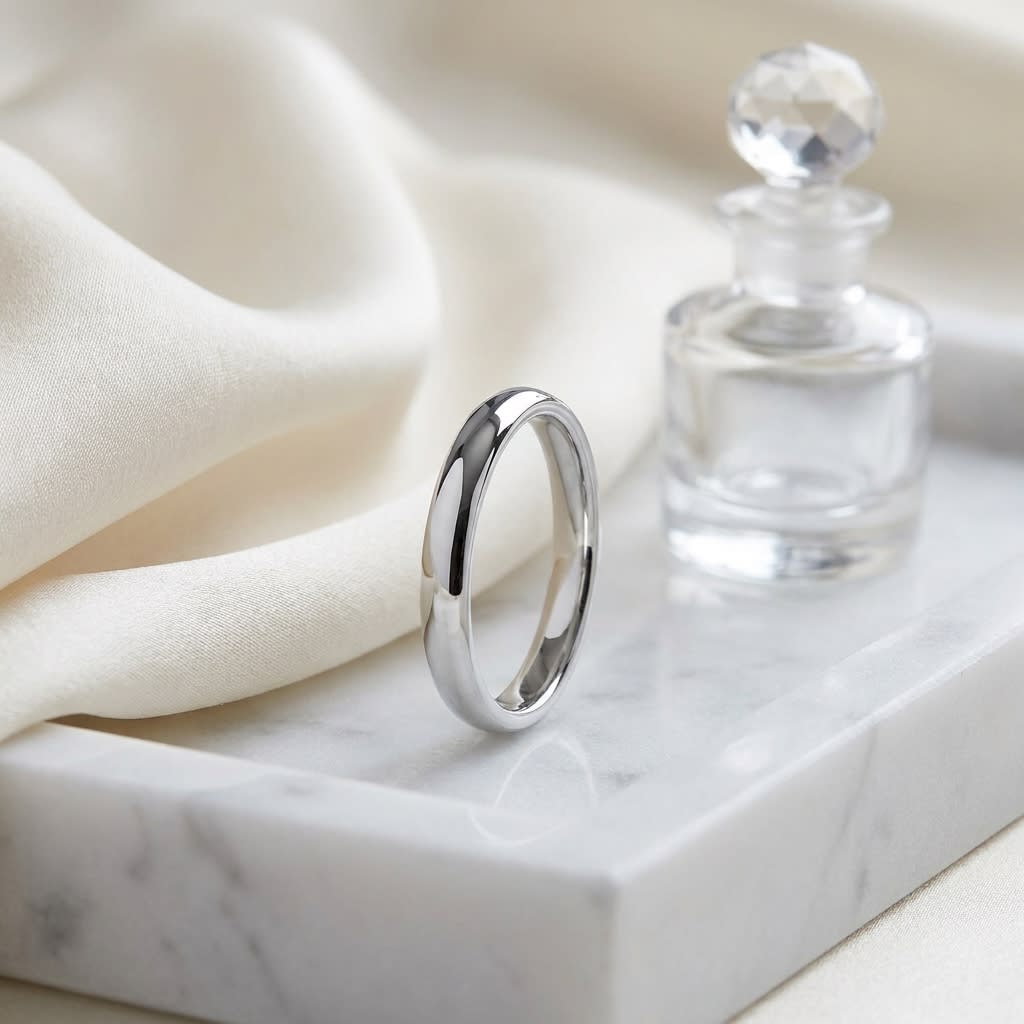 3mm Slightly Domed Comfort-Fit Wedding Band in 18K White Gold, on marble vanity tray with silk