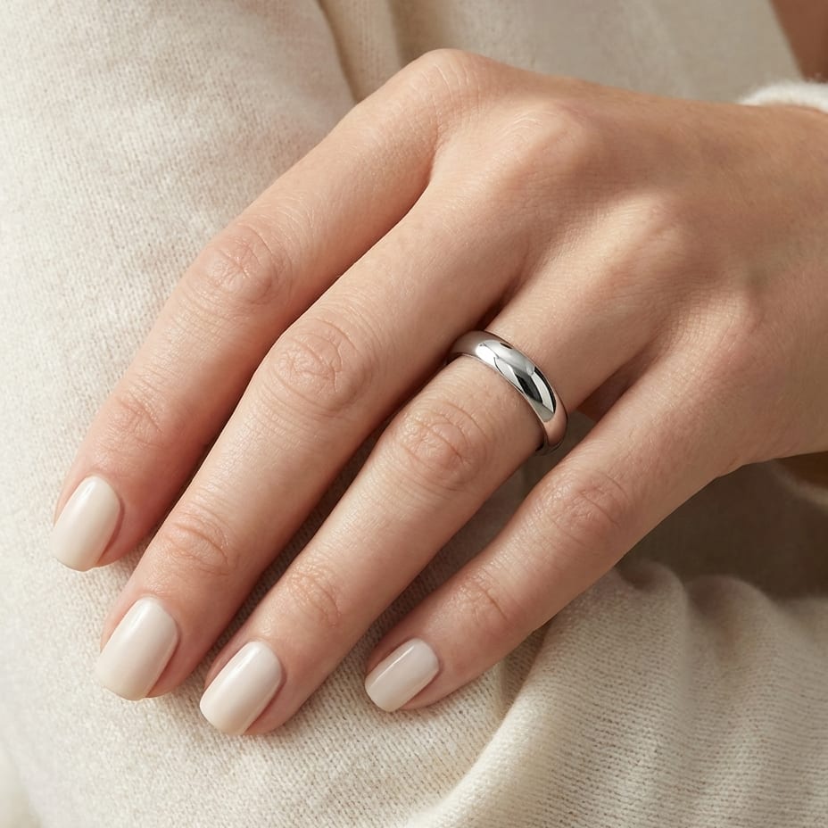4mm Slightly Domed Comfort-Fit Wedding Band in 18K White Gold, worn on hand, close-up