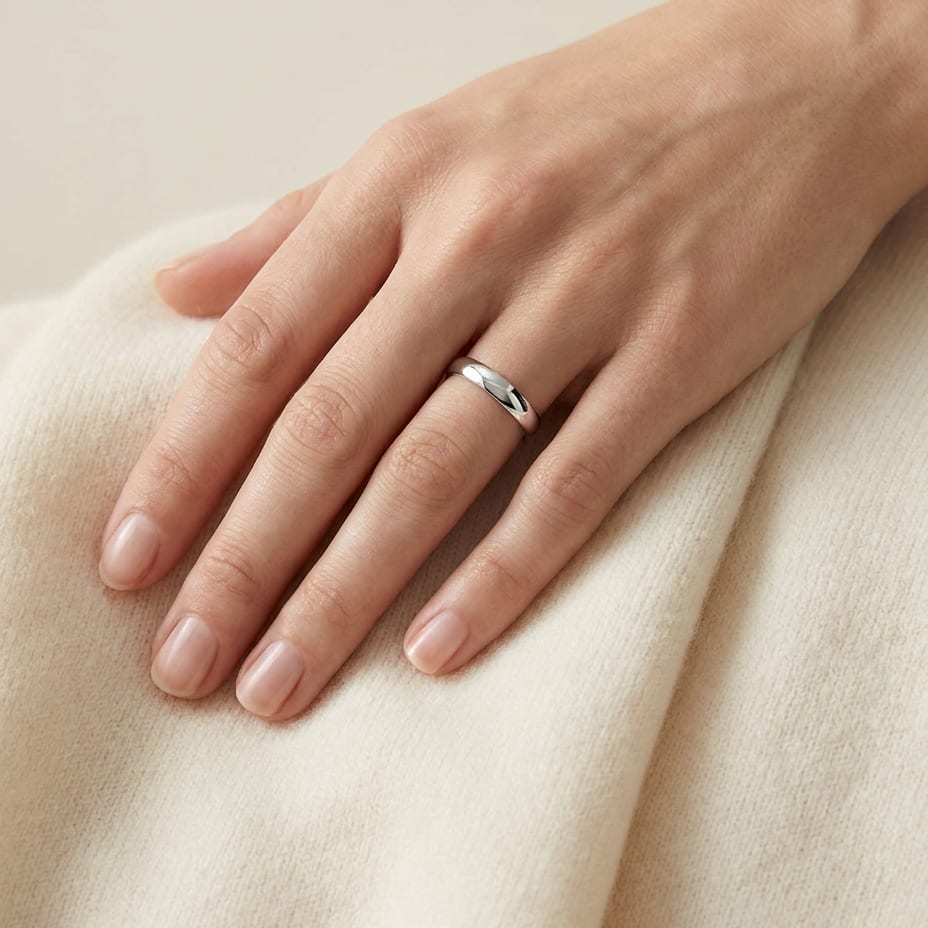 4mm Slightly Domed Comfort-Fit Wedding Band in 18K White Gold, worn on hand, full view