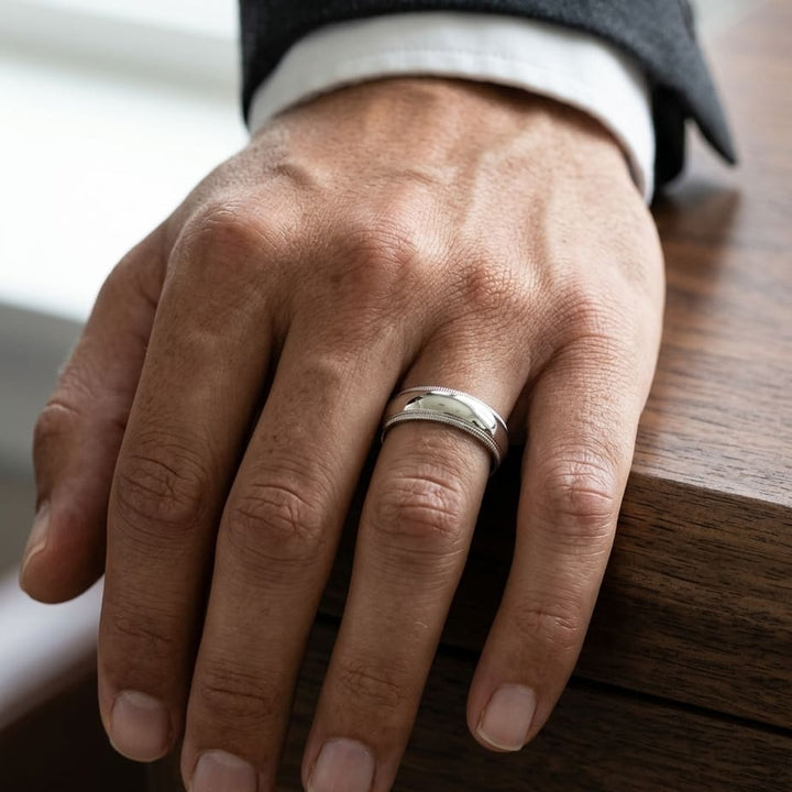 7mm Slightly Domed Double Milgrain Comfort-Fit Wedding Band in 18K White Gold, worn on hand, masculine close-up