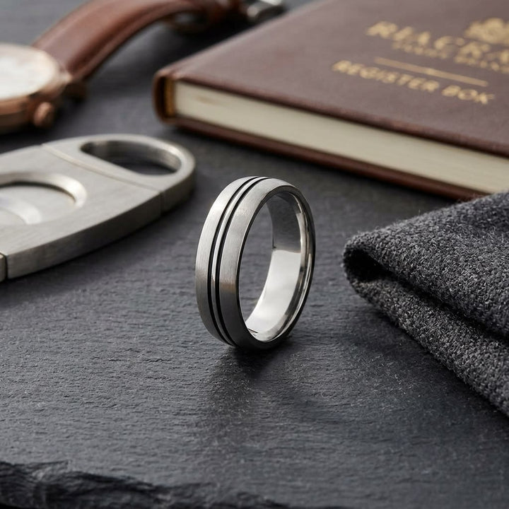 6mm Satin Finish High Polished Center Cut Carved Wedding Band in 18K White Gold, on walnut surface with pocket square