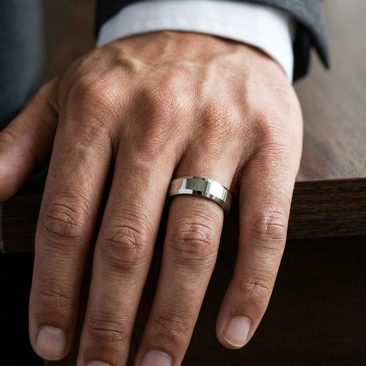 6mm High Polish Carved Wedding Band in 18K White Gold, worn on hand, masculine close-up