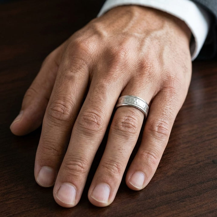 6mm Hammered Center High Polish Round Edge Carved Wedding Band in 18K White Gold, worn on hand, masculine close-up