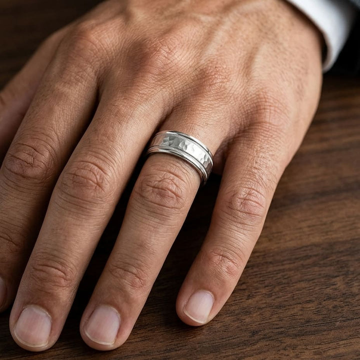 8mm Hammered Center High Polish Round Edge Carved Wedding Band in 18K White Gold, worn on hand, masculine close-up