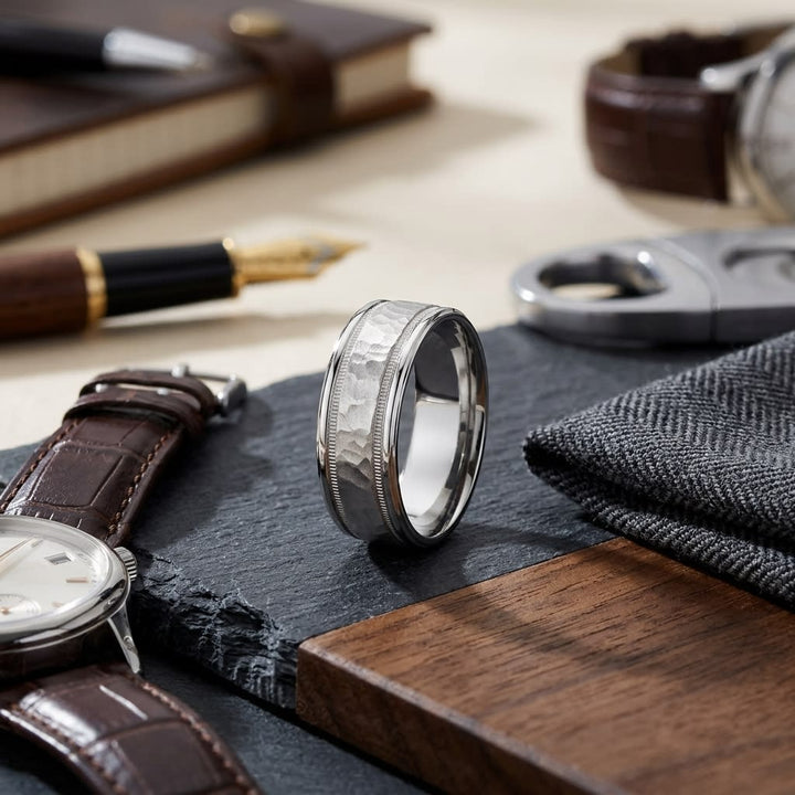 8mm Hammered Center High Polish Round Edge Carved Wedding Band in 18K White Gold, on walnut surface with pocket square