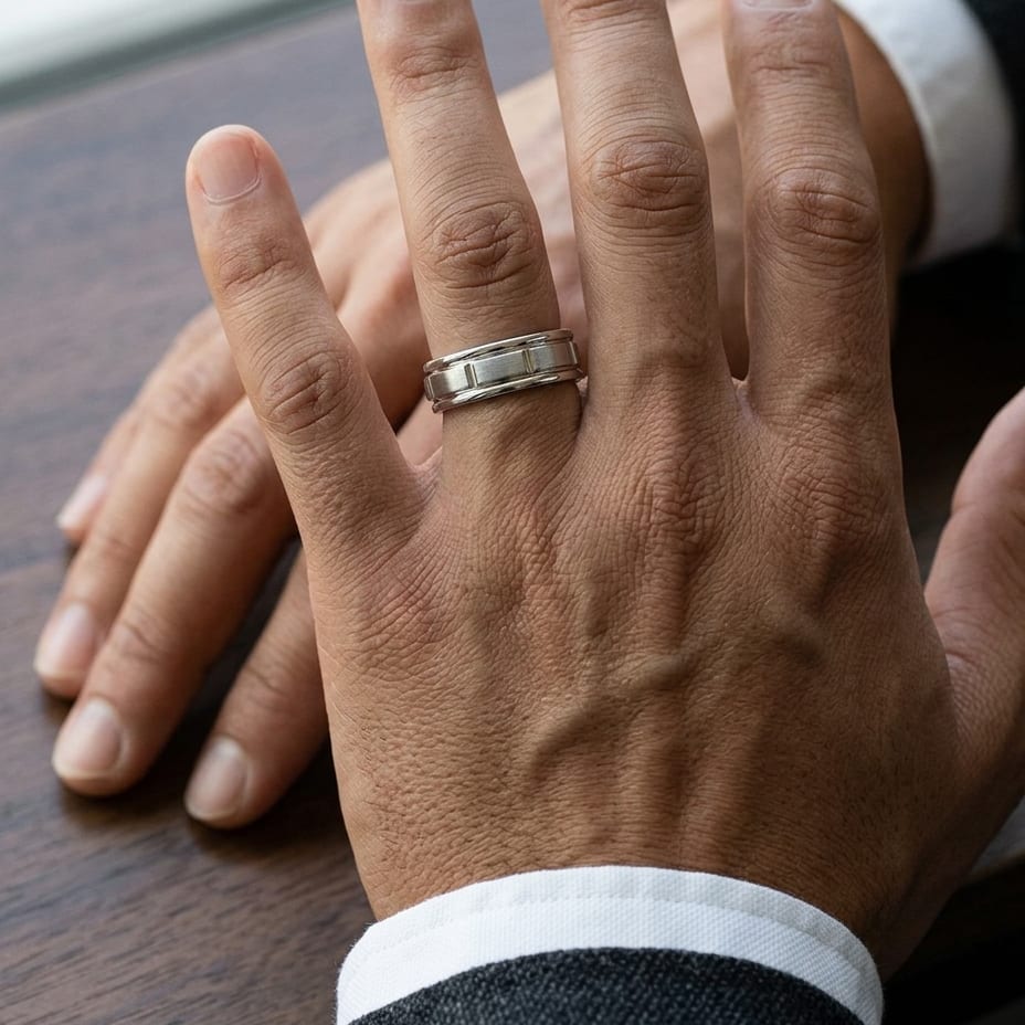 6mm Satin Finish High Polished Center Cut Carved Wedding Band in 18K White Gold, worn on hand, masculine close-up