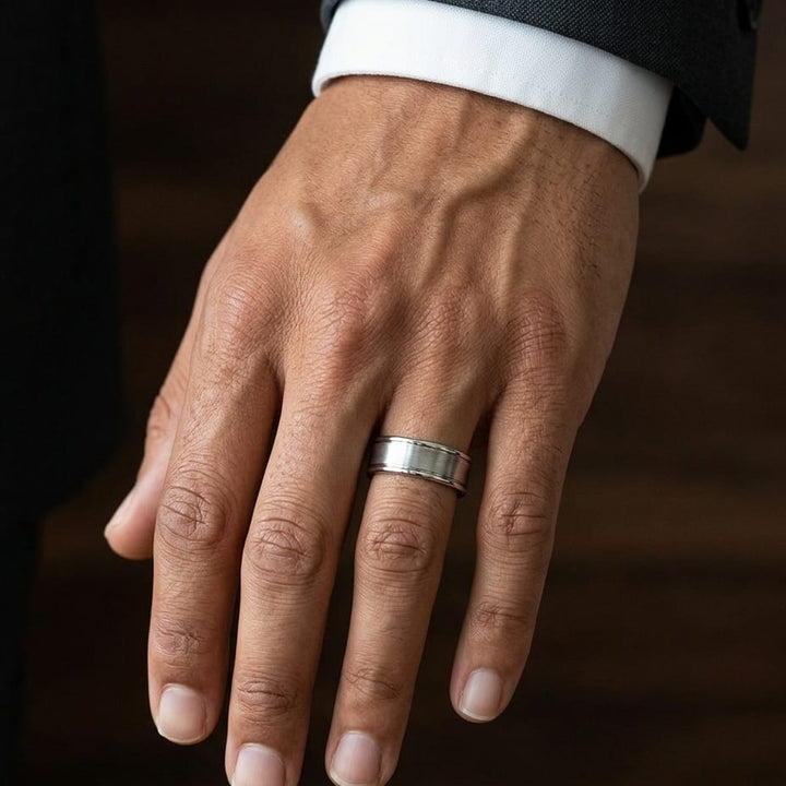 7.5mm Satin Finish High Polished Round Edge Carved Wedding Band in 18K White Gold, worn on hand, masculine close-up