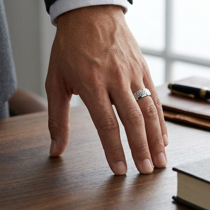 7.5mm Hammered Finish Beveled Edge Carved Wedding Band in 18K White Gold, worn on hand, masculine full view