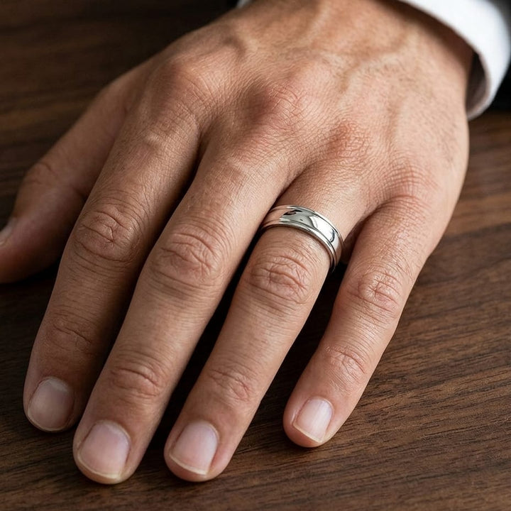 6mm High Polish Round Edge Carved Wedding Band in 18K White Gold, worn on hand, masculine close-up