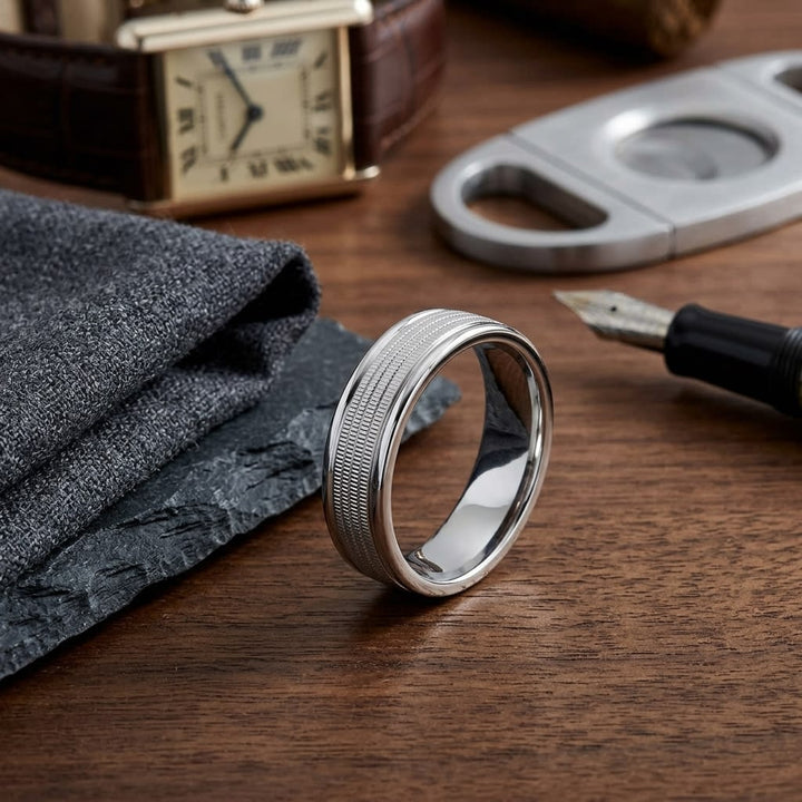 6mm High Polish Milgrain Round Edge Carved Wedding Band in 18K White Gold, on walnut surface with pocket square