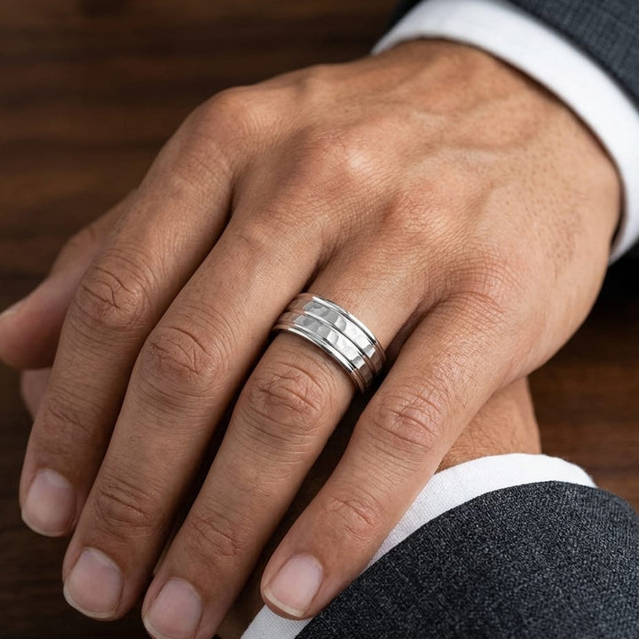 7.5mm High Polish Round Edge Carved Wedding Band in 18K White Gold, worn on hand, masculine close-up
