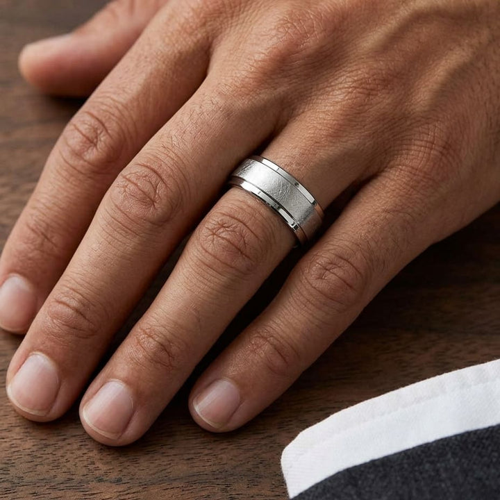 7mm Round Edge Swirl Finish Carved Wedding Band in 18K White Gold, worn on hand, masculine close-up
